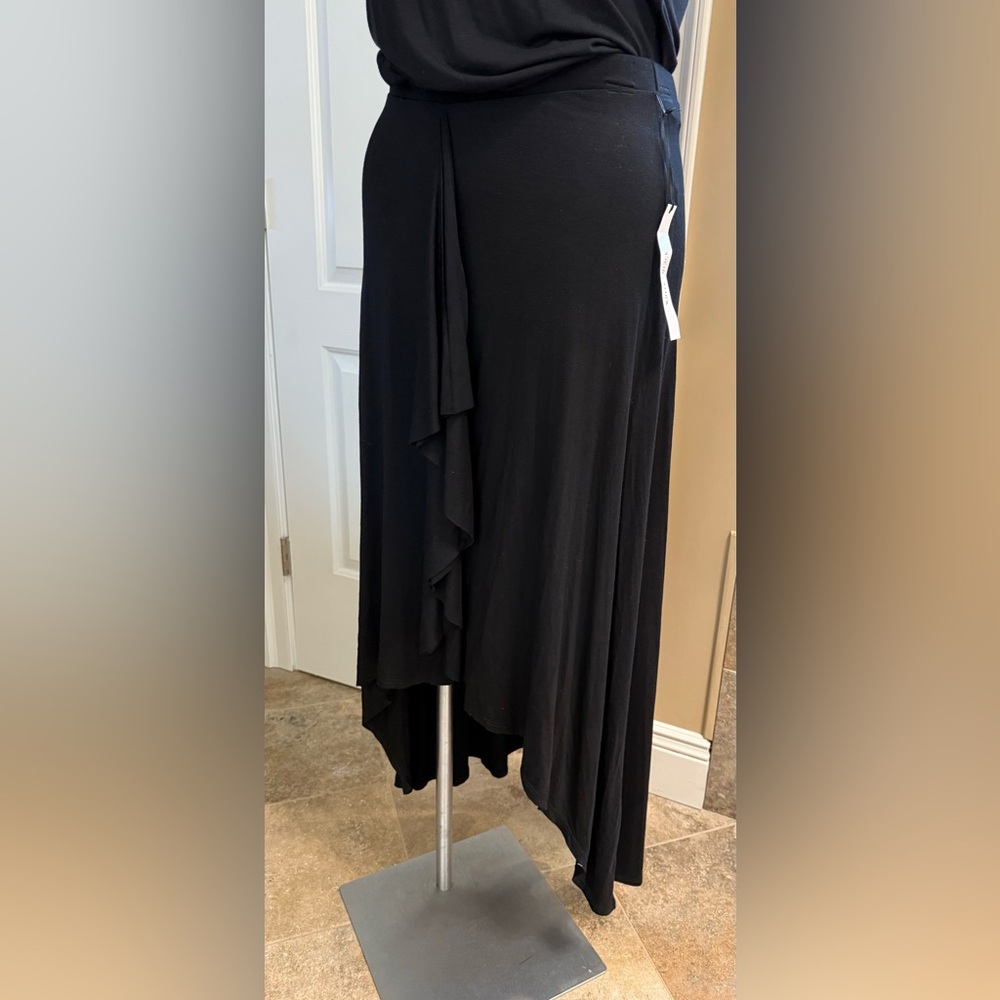 Maxi skirt with an asymmetrical hemline and ruffling detailing down the front